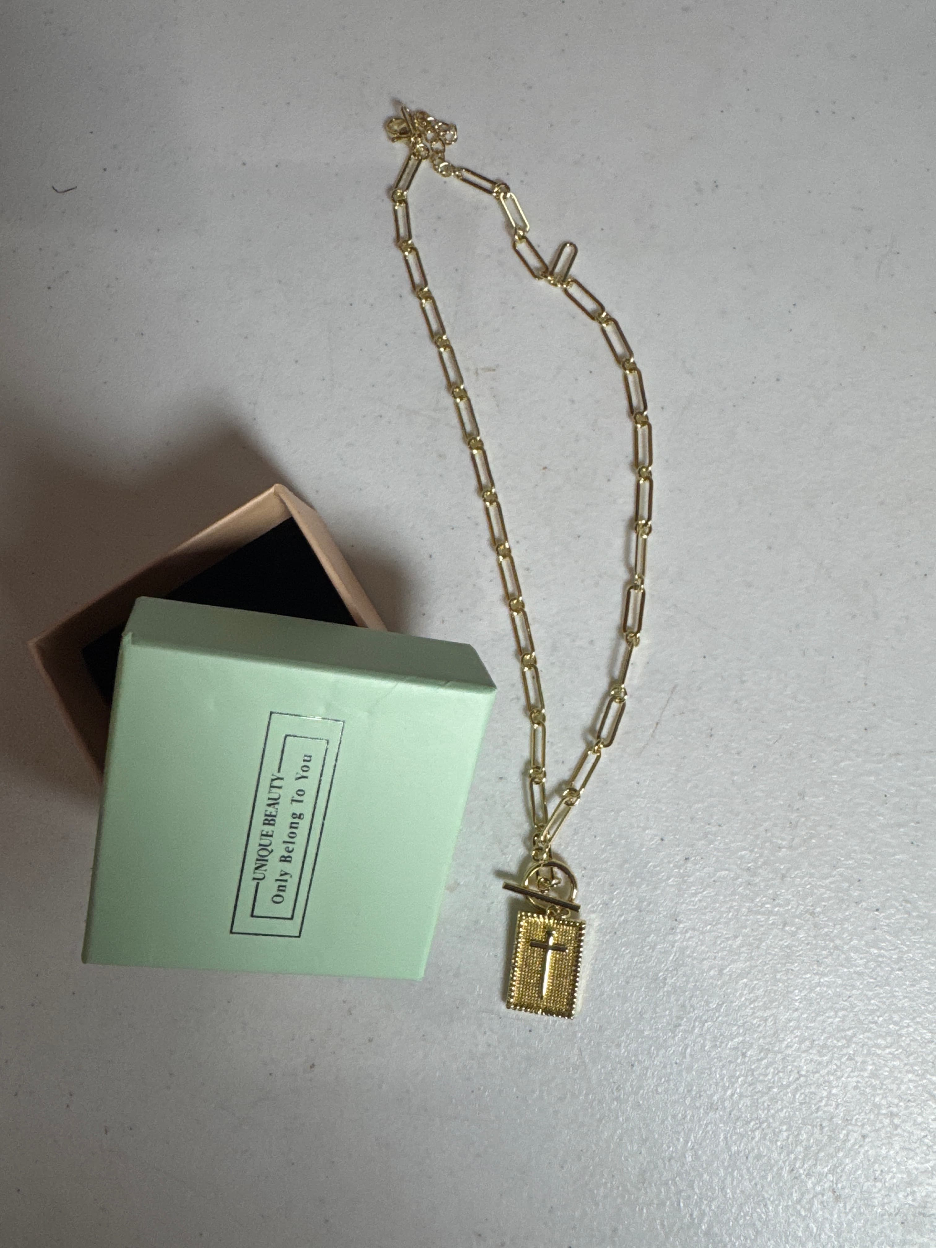 Gold chain necklace with cross charm